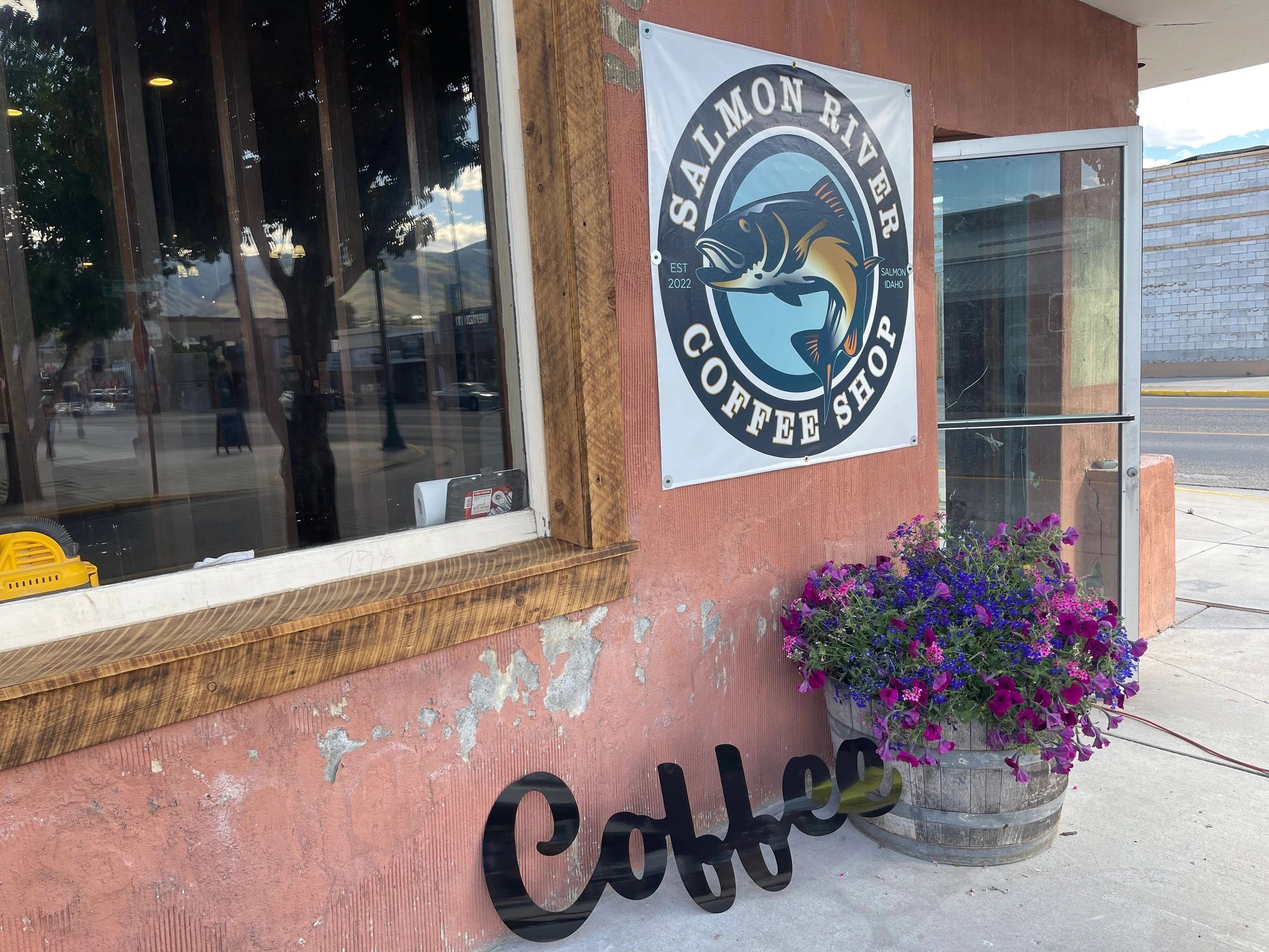 Salmon River Coffee Shop storefront with flowers